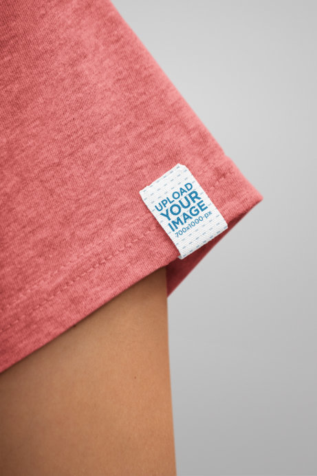 Clothing Label Mockup of a Woman Wearing a Heathered T-Shirt