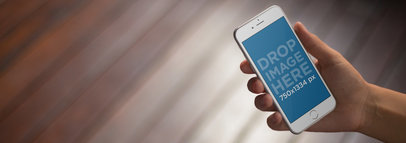 Mockup Template of a Man Using an iPhone at Home