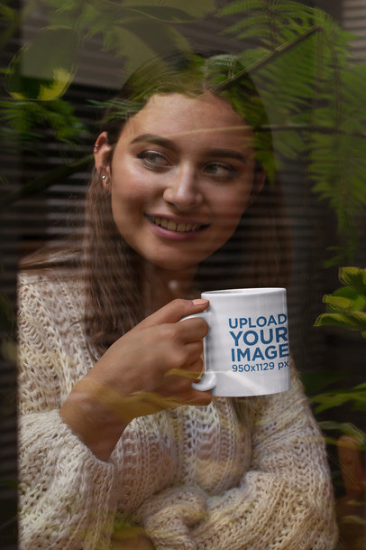 Mockup of a Smiling Woman Holding an 11 oz Coffee Mug