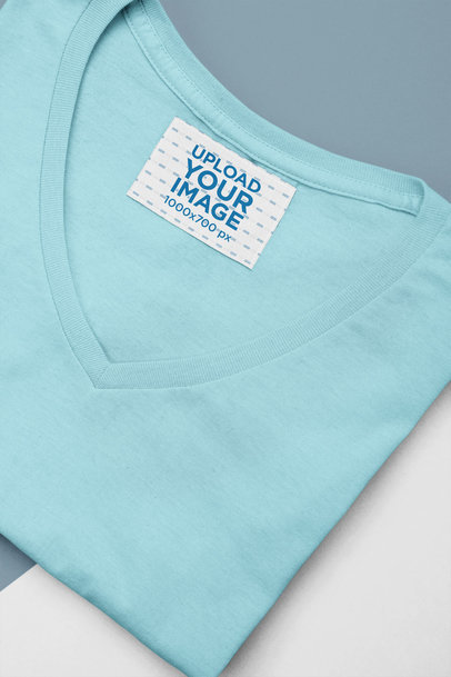 Clothing Label Mockup Featuring a Folded V-Neck T-Shirt 
