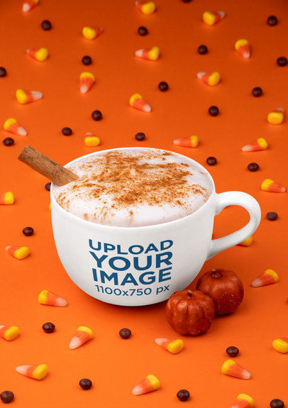 Mockup of a 24 oz Mug Surrounded by Halloween Candy