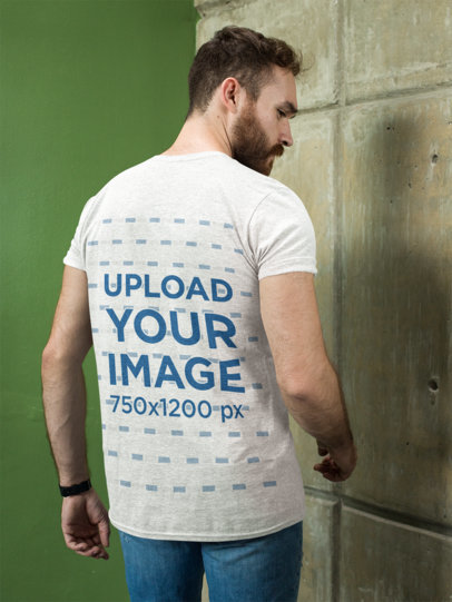 Heathered T-Shirt Mockup of a Bearded Man Facing the Wall 