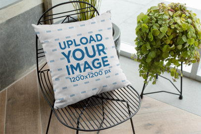 Mockup of a Pillow on a Chair 