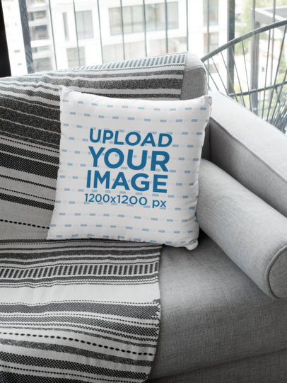 Square Pillow Mockup Featuring a Grey Fabric Couch 