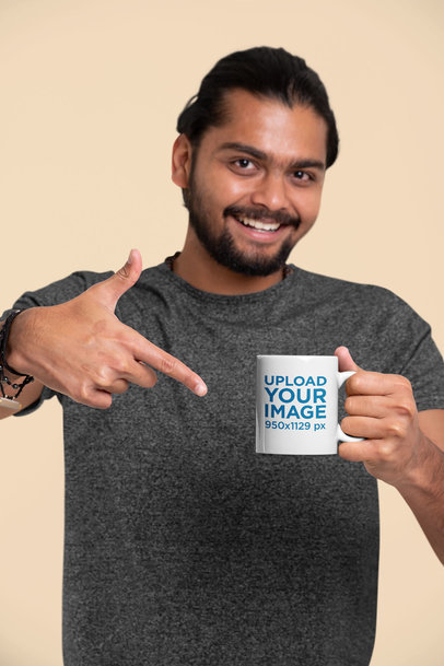 Mockup Featuring a Joyful Man Pointing at an 11 oz Coffee Mug 