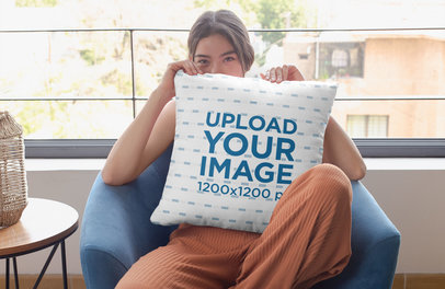 Pillow Mockup Featuring a Woman Hiding Her Face 