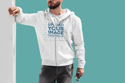 Full-Zip Hoodie Mockup of a Bearded Man Posing Against a Customizable Background 