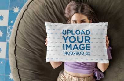 Mockup of a Woman Covering Her Face with a Throw Pillow