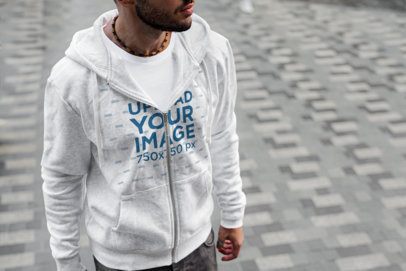 Heathered Full-Zip Hoodie Mockup Featuring a Bearded Man at a Street