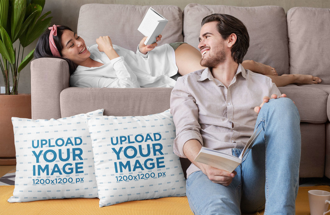 Mockup of a Couple Reading in the Couch with Two Pillows