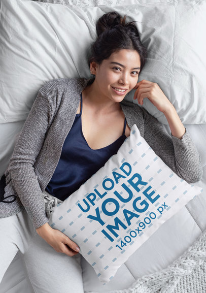 Mockup of a Woman Holding a Pillow in Bed 