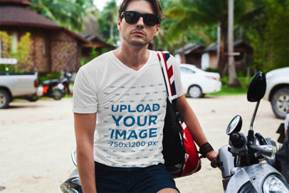 V-Neck T-Shirt Mockup Featuring a Man with Sunglasses on a Motorcycle