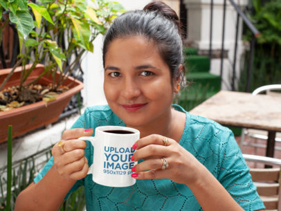 11 oz Mug Mockup Featuring a Woman with a Hair Bun Drinking Coffee 