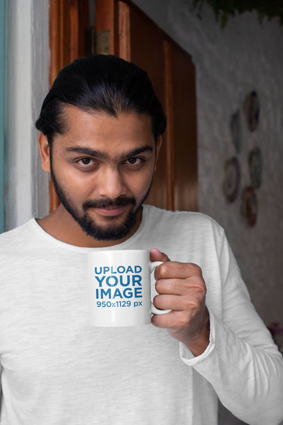 11 oz Mug Mockup Featuring a Man Drinking Coffee While Looking at the Camera