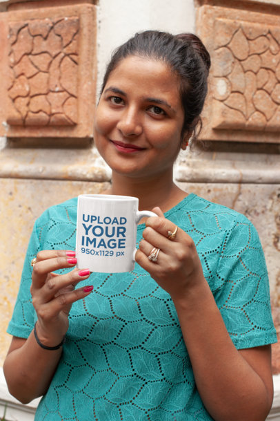 Mockup of a Woman Having a Cup of Coffee in Her 11 oz Mug Outside