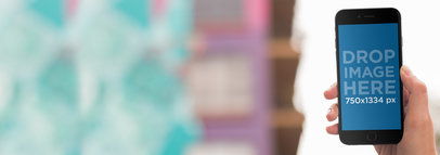 iPhone Mockup Featuring a Girl at a Boutique a9304