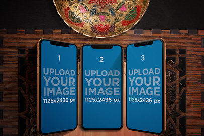 Mockup of Three iPhones 11 Pro in an Arabic Setting 
