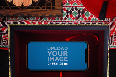 Mockup of an iPhone 11 Pro in Landscape Position in an Arabic Setting