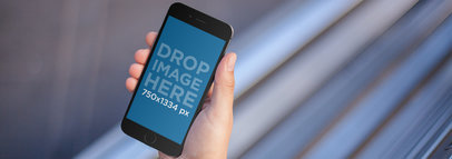 Mockup Template of a Man at a Train Station Using an iPhone