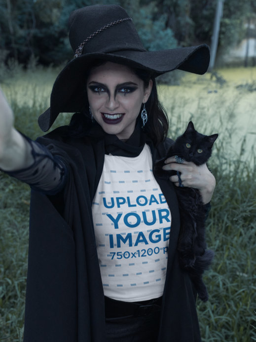 T-Shirt Mockup of a Fierce Witch Holding a Cat