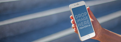 Mockup Template of a Guy Using an iPhone in an Urban Environment