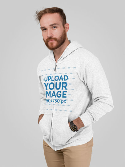 Mockup of a Man Wearing a Heathered Hoodie in a Studio