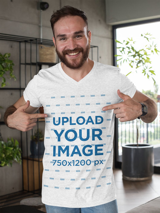 Mockup of a Man Pointing At His Heathered T-Shirt 