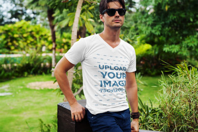 T-Shirt Mockup of a Fashionable Man Posing at a Park