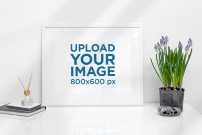 Mockup of a Picture Frame Placed By an Indoor Plant 504-el