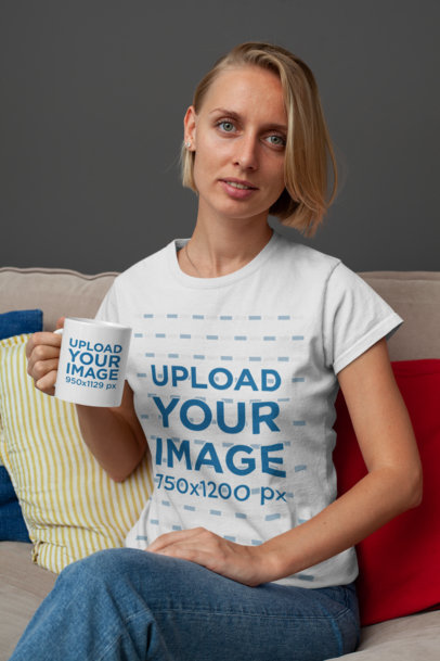 T-Shirt Mockup of a Woman Sitting on a Couch While Holding an 11 oz Mug 