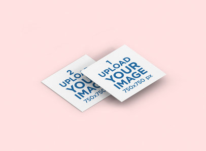 Mockup of Two Overlapping Square Business Cards Lying on a Solid Color Surface