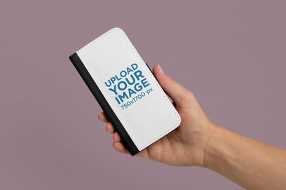 Mockup of a Hand Holding a Wallet Case for iPhone X 29249