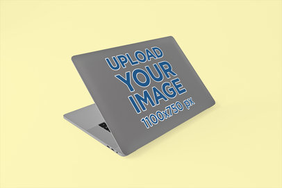 Sticker Mockup of a MacBook Pro with a Customizable Backdrop