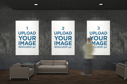 Mockup of Three Exhibition Posters Hanging Against a Dark Wall 