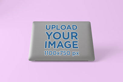 Laptop Sticker Mockup Featuring a Solid Color Background