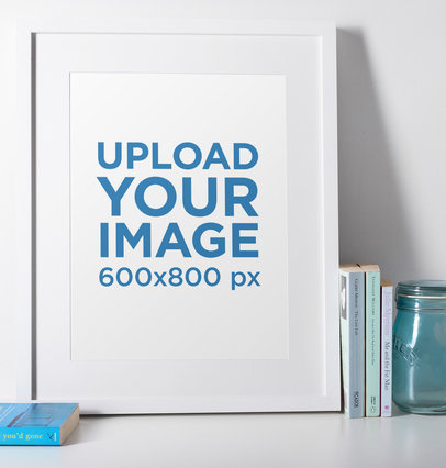 Photo Frame Mockup Featuring a Blue Glass Jar and Some Books 
