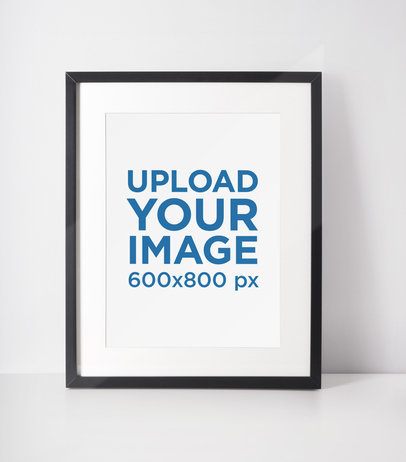 Mockup of a Photo Frame Standing on a White Surface