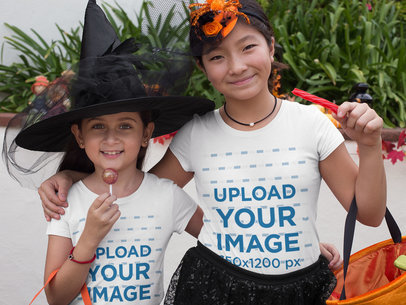 T-Shirt Mockup of Two Girls Trick-or-Treating in Witch Hats