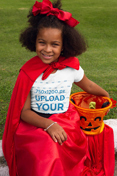 Mockup of a Girl Wearing a T-Shirt and Carrying a Pumpkin Bucket