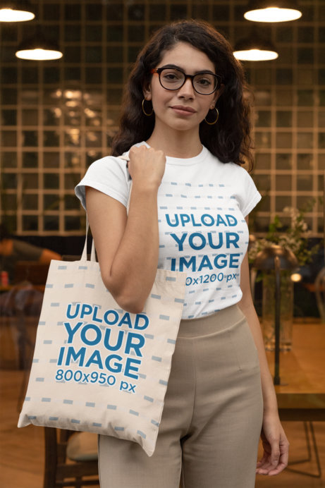 T-Shirt Mockup Featuring a Woman Carrying a Tote Bag 