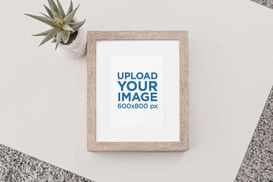 Mockup of a Wooden Picture Frame in a Set with Earthy Colors