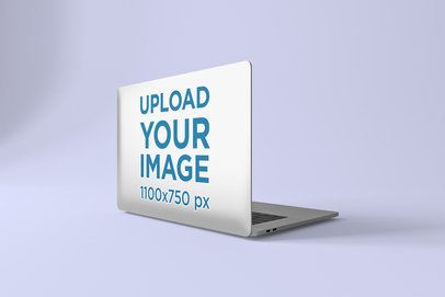 Sticker Mockup Featuring a Macbook Pro at a Studio