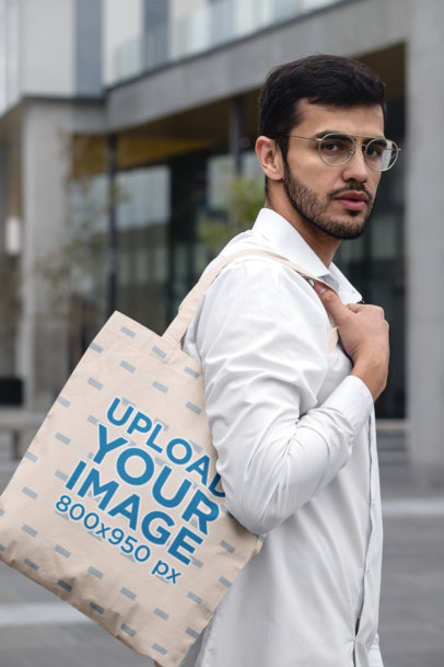 Tote Bag Mockup Featuring a Stylish Man in an Urban Scenario