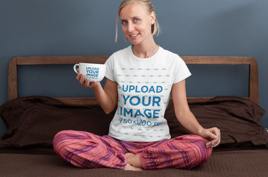 T-Shirt Mockup of a Woman Holding a 24 oz Mug in Her Bedroom 