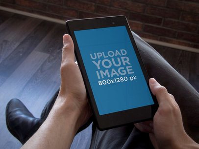 Nexus 7 Mockup in Portrait Position Featuring a Business Man