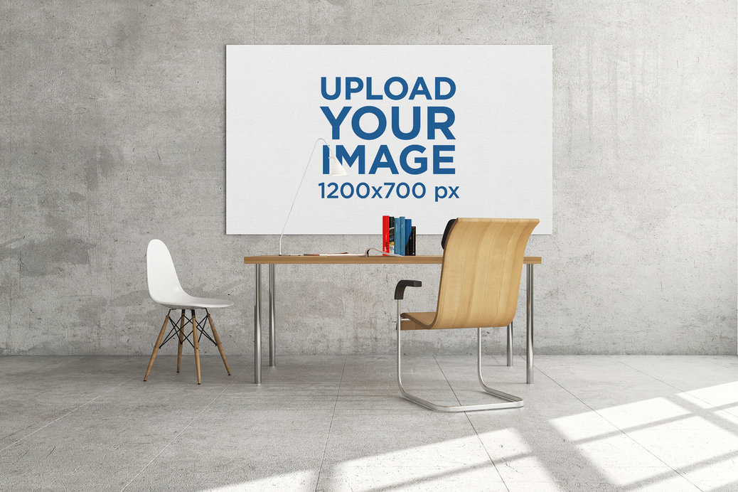 Mockup Featuring an Art Print Hanging Behind a Work Desk 