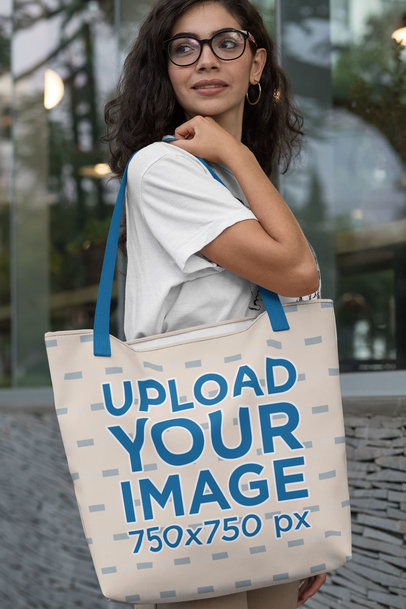 Mockup of a Woman Carrying a Tote Bag with Customizable Strap Over Her Shoulder