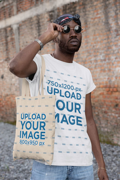 T-Shirt Mockup of a Cool Man with Sunglasses Carrying a Tote Bag 