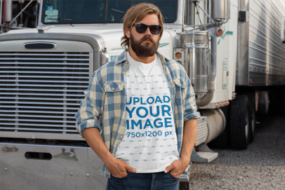 Mockup of a Man Wearing a T-Shirt and Posing in Front of His Truck 