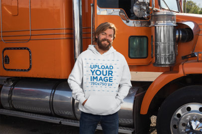 Mockup of a Man Wearing a Pullover Hoodie in Front of a Truck